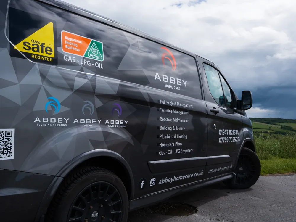 Gas Safe registration and trade marks on the side of an Abbey Group van