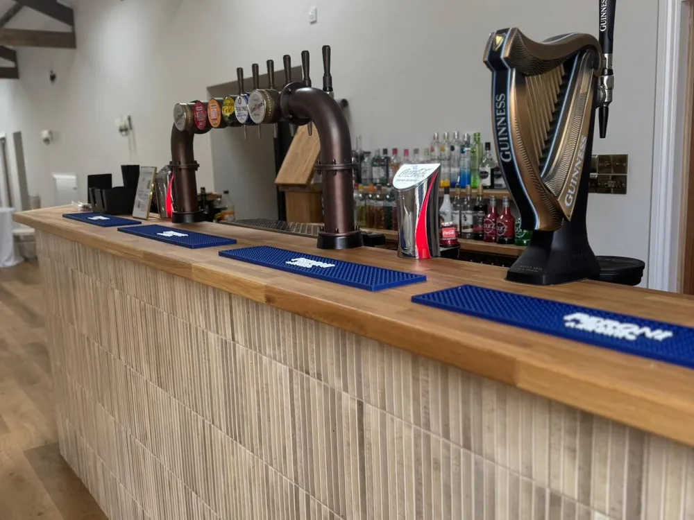Bar front and oak worktop in a function room fitted out by Abbey Group
